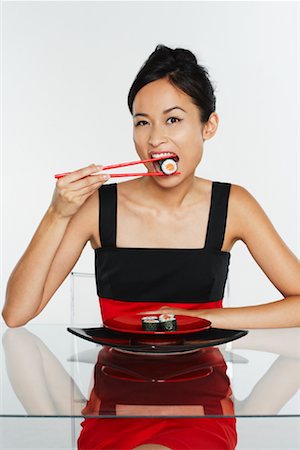 fashion plate - Woman Eating Sushi Stock Photo - Premium Royalty-Free, Code: 600-01695178