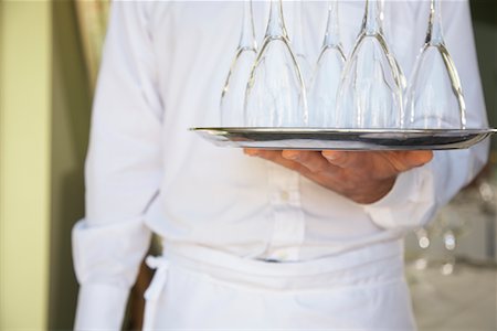 simsearch:600-01646509,k - Waiter Carrying Tray of Wine Glasses Stock Photo - Premium Royalty-Free, Code: 600-01693901
