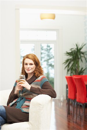 Woman in Chair with White Wine Stock Photo - Premium Royalty-Free, Code: 600-01693986