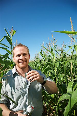 Farmer with Thermos in Cornfield Stock Photo - Premium Royalty-Free, Code: 600-01715961