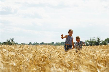 farm active - Brother and Sister Running through Grain Field Stock Photo - Premium Royalty-Free, Code: 600-01716065