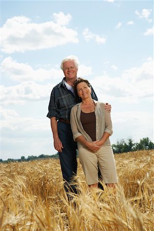 Portrait of Couple in Grain Field Stock Photo - Premium Royalty-Free, Code: 600-01716069