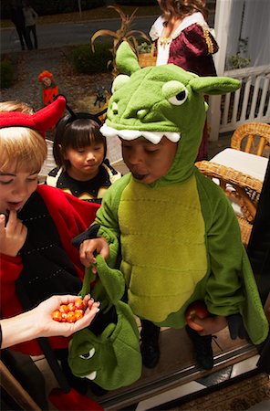 Children Trick or Treating at Halloween Stock Photo - Premium Royalty-Free, Code: 600-01717704