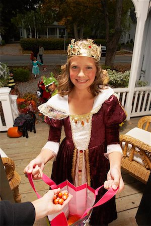 Portrait of Girl Trick or Treating at Halloween Stock Photo - Premium Royalty-Free, Code: 600-01717702