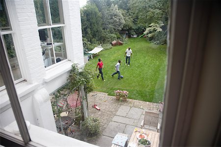 Family Playing in Backyard Stock Photo - Premium Royalty-Free, Code: 600-01717950