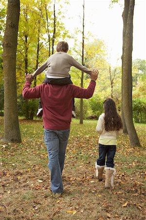 Father and Children Walking in Autumn Stock Photo - Premium Royalty-Free, Code: 600-01742512