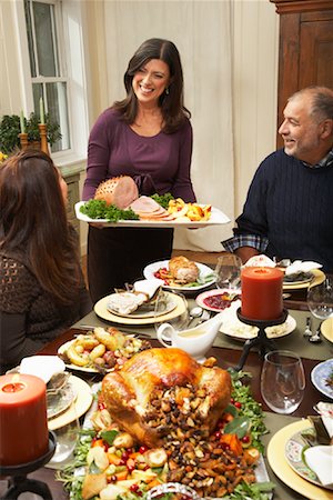 family man dinner table - Woman Serving Thanksgiving Dinner Stock Photo - Premium Royalty-Free, Code: 600-01742529