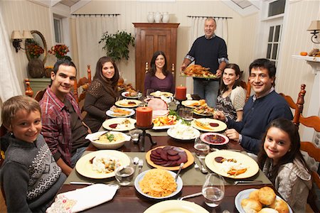 family man dinner table - Family Having Thanksgiving Dinner Stock Photo - Premium Royalty-Free, Code: 600-01742535