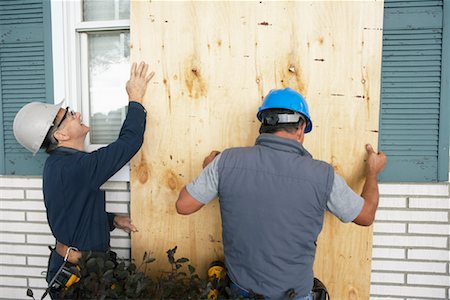 simsearch:600-01742614,k - Construction Workers Covering Window with Board Stock Photo - Premium Royalty-Free, Code: 600-01742678