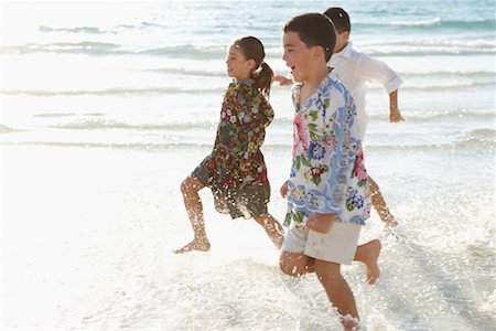 Children Running on the Beach Stock Photo - Premium Royalty-Free, Code: 600-01755487