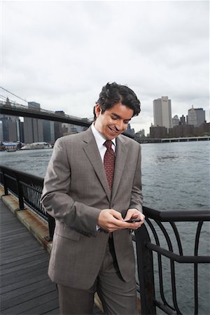 simsearch:700-03058969,k - Businessman by Brooklyn Bridge, New York City, New York, USA Stock Photo - Premium Royalty-Free, Code: 600-01764121