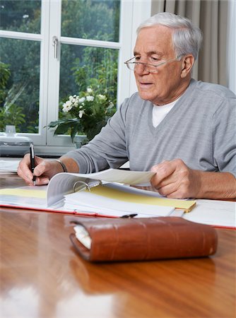 paid - Man Paying Bills Stock Photo - Premium Royalty-Free, Code: 600-01764424