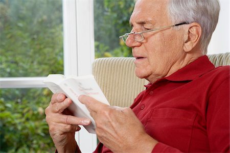 profile man - Man Reading Book Stock Photo - Premium Royalty-Free, Code: 600-01764458