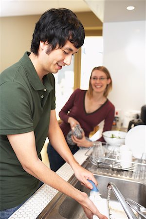 Man and Woman Washing Dishes Stock Photo - Premium Royalty-Free, Code: 600-01764685