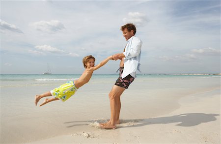 father son shore - Father Playing with Son on Beach, Majorca, Spain Stock Photo - Premium Royalty-Free, Code: 600-01764743