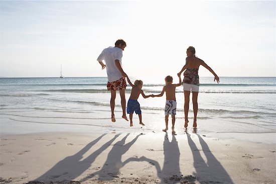 holding hands jumping.  Family beach holiday not i… family holding hands family holiday family 