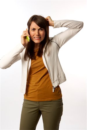 simsearch:600-03244230,k - Frustrated Woman on Cell Phone Stock Photo - Premium Royalty-Free, Code: 600-01765031