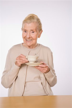 elderly woman posing - Portrait of Woman Drinking Tea Stock Photo - Premium Royalty-Free, Code: 600-01788453