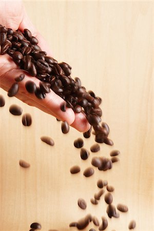 Hand Pouring Coffee Beans Stock Photo - Premium Royalty-Free, Code: 600-01788532