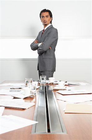 executive office profile - Businessman at Messy Boardroom Table Stock Photo - Premium Royalty-Free, Code: 600-01788807