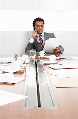 simsearch:600-02756616,k - Businessman at Boardroom Table with Cellular Phone and Documents Foto de stock - Sin royalties Premium, Código: 600-01788809