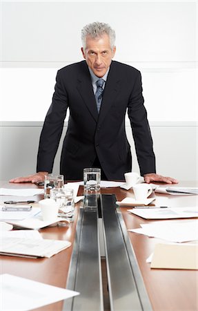 simsearch:600-01613965,k - Businessman at Messy Boardroom Table Stock Photo - Premium Royalty-Free, Code: 600-01788811