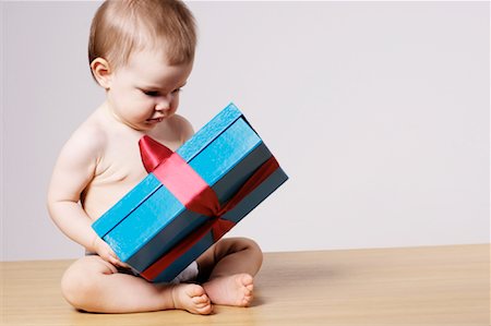 Portrait of Baby Holding Gift Stock Photo - Premium Royalty-Free, Code: 600-01790079