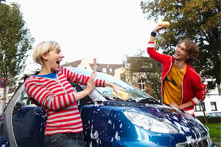 Couple Washing Car, Play Fighting Stock Photo - Premium Royalty-Free, Code: 600-01827057