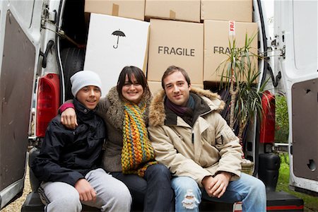 simsearch:600-01083008,k - Family Sitting on Back of Moving Van Stock Photo - Premium Royalty-Free, Code: 600-01827082