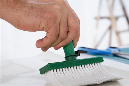 Man Applying Wallpaper Glue to Wallpaper Stock Photo - Premium Royalty-Free, Code: 600-01827111