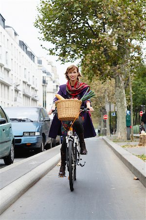 riding bike with basket - Woman Riding Bicycle Stock Photo - Premium Royalty-Free, Code: 600-01827659