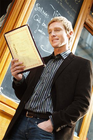 Man Reading Menu Stock Photo - Premium Royalty-Free, Code: 600-01827668