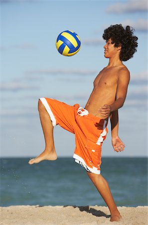 simsearch:700-02264741,k - Boy Playing with Volleyball on Beach Stock Photo - Premium Royalty-Free, Code: 600-01838208