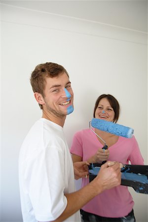 Couple with Wall Paint on Faces Foto de stock - Sin royalties Premium, Código: 600-01838288