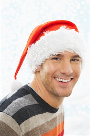 santa claus hat - Portrait of Man Wearing Santa Hat Stock Photo - Premium Royalty-Free, Code: 600-01838440