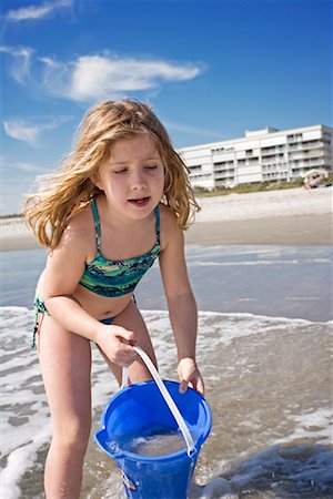 Girl Playing on Beach Stock Photo - Premium Royalty-Free, Code: 600-01879137