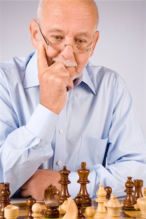 Man Playing Chess Stock Photo - Premium Royalty-Free, Code: 600-01954292