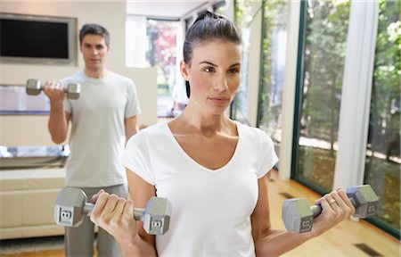 Couple Exercising in Home Stock Photo - Premium Royalty-Free, Code: 600-01954791