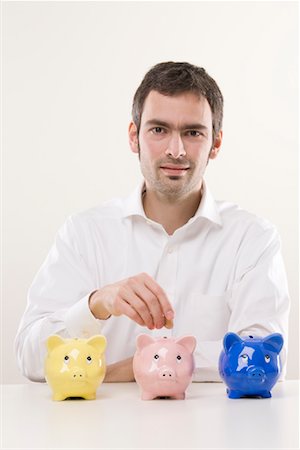 Man with Piggy Banks Stock Photo - Premium Royalty-Free, Code: 600-02010046