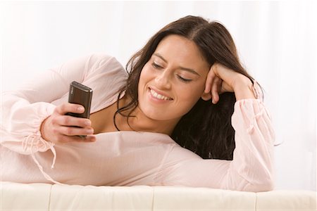 simsearch:700-01199784,k - Woman Reading Text Message Stock Photo - Premium Royalty-Free, Code: 600-02010051