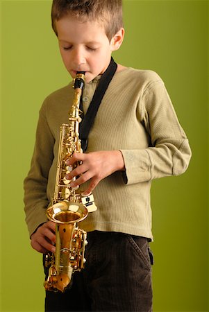 Boy Playing Saxophone Stock Photo - Premium Royalty-Free, Code: 600-02038298