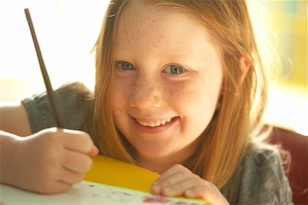 freckled girl - Portrait of Girl Drawing Stock Photo - Premium Royalty-Free, Code: 600-02046958