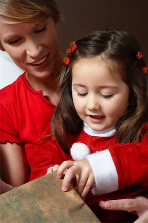 Mother and Daughter Opening Christmas Presents Stock Photo - Premium Royalty-Free, Code: 600-02071831
