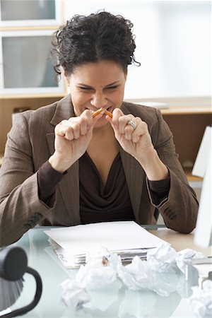 Businesswoman Sitting at Desk Writing Stock Photo - Premium Royalty-Free, Code: 600-02081724