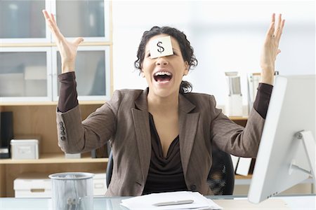 Businesswoman Sitting at Desk with Self Adhesive Note on Forehead Stock Photo - Premium Royalty-Free, Code: 600-02081733