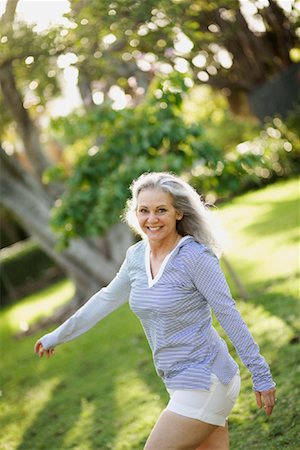 Woman Walking in Park Stock Photo - Premium Royalty-Free, Code: 600-02129030