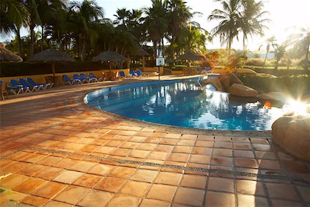 puerto vallarta - Resort Swimming Pool at Sunrise, Fairmont Rancho Banderas, Bahia de Banderas, Nayarit, Mexico Stock Photo - Premium Royalty-Free, Code: 600-02121206