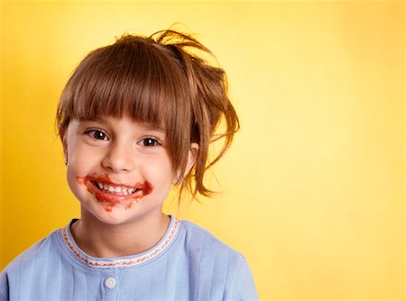 delicious - Portrait of Girl With Spaghetti Sauce on Face Stock Photo - Premium Royalty-Free, Code: 600-02123739