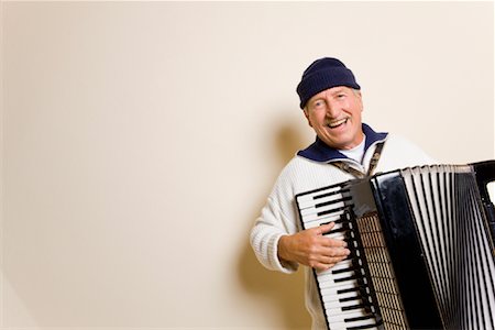 Man Playing Accordion Stock Photo - Premium Royalty-Free, Code: 600-02193921