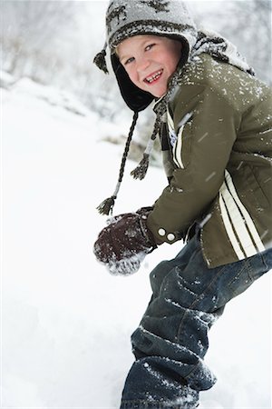 snow ball - Boy Making Snowball Stock Photo - Premium Royalty-Free, Code: 600-02200099